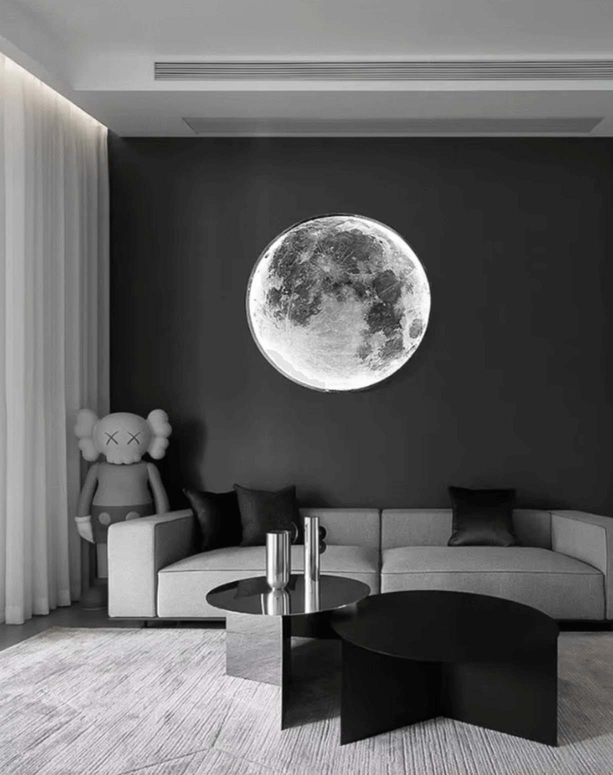 Moon Wall Light illuminating a modern living room, creating a magical atmosphere with dimmable lighting options.