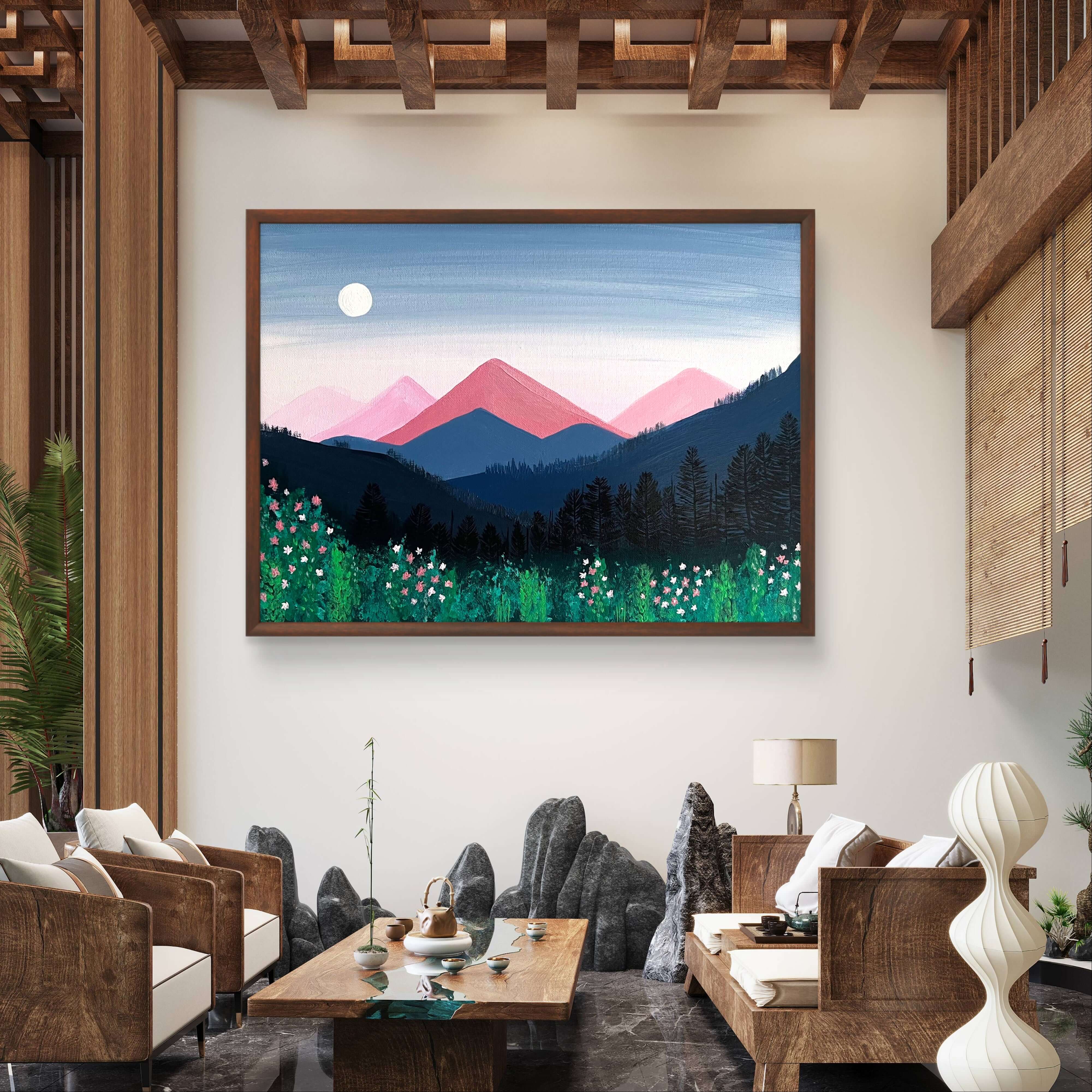 Hand-painted acrylic artwork "Romantische Berge" with pink and indigo mountains in a serene living room setting.