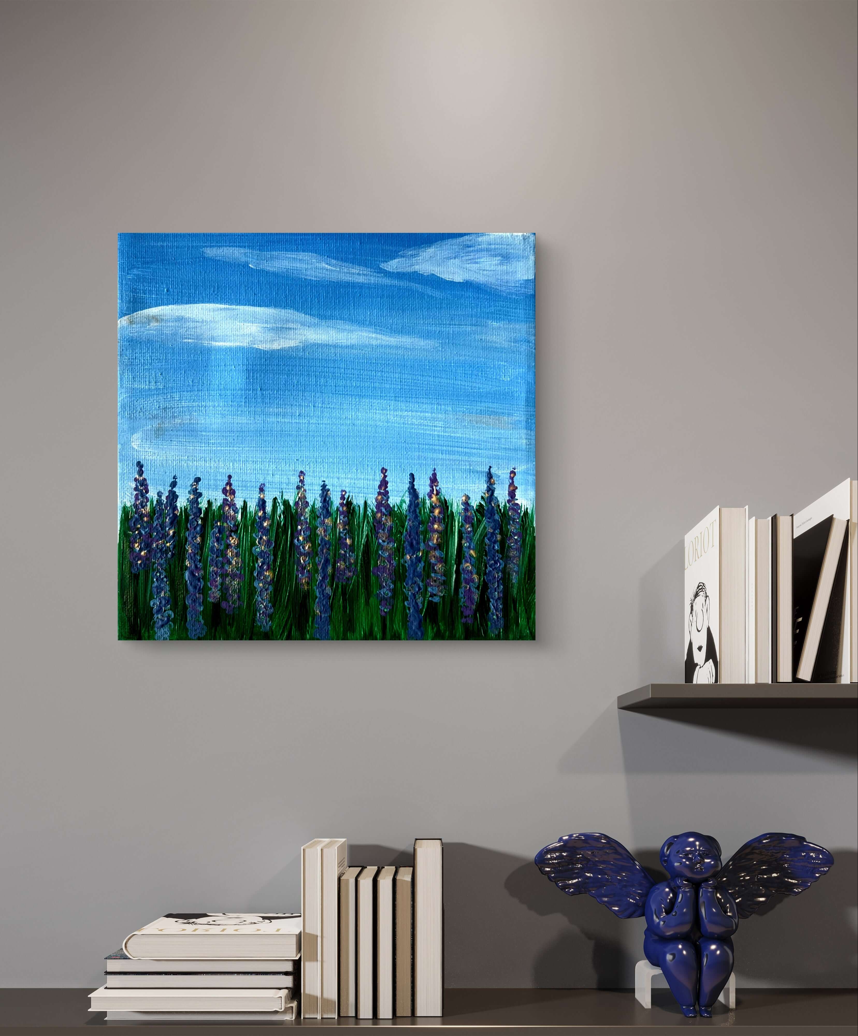 "Blütenwiese im Sommerwind" acrylic painting featuring lupines and a blue sky, displayed on a modern interior wall.