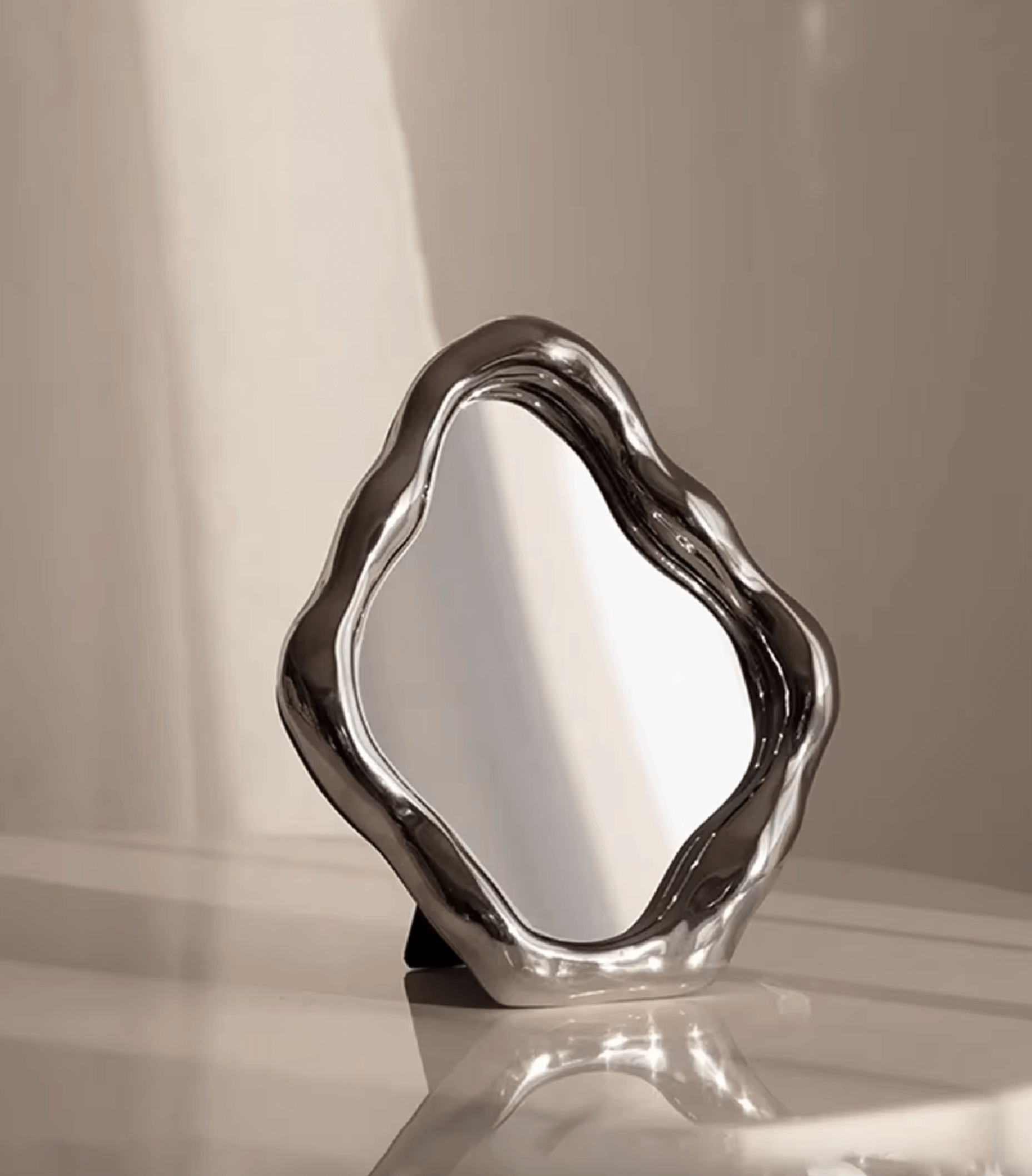 Elegant freestanding table mirror with artistic ceramic frame, perfect for home decor and photography accessories.