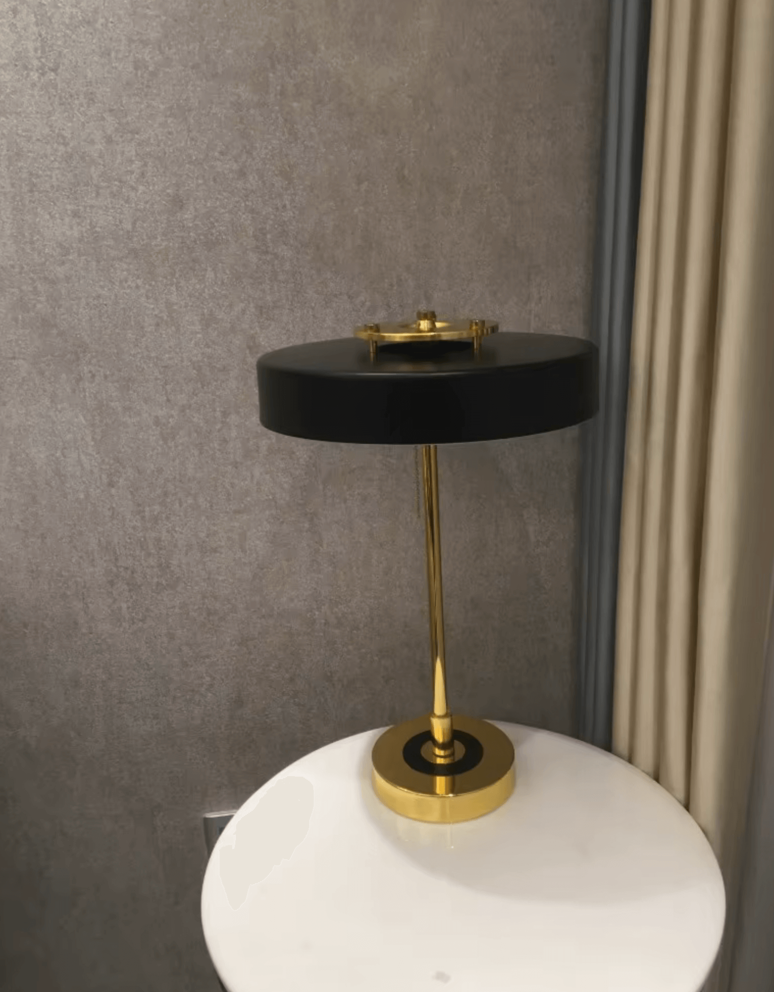Nordic Glow LED table lamp with gold accents on a white surface, showcasing minimalist Scandinavian design.