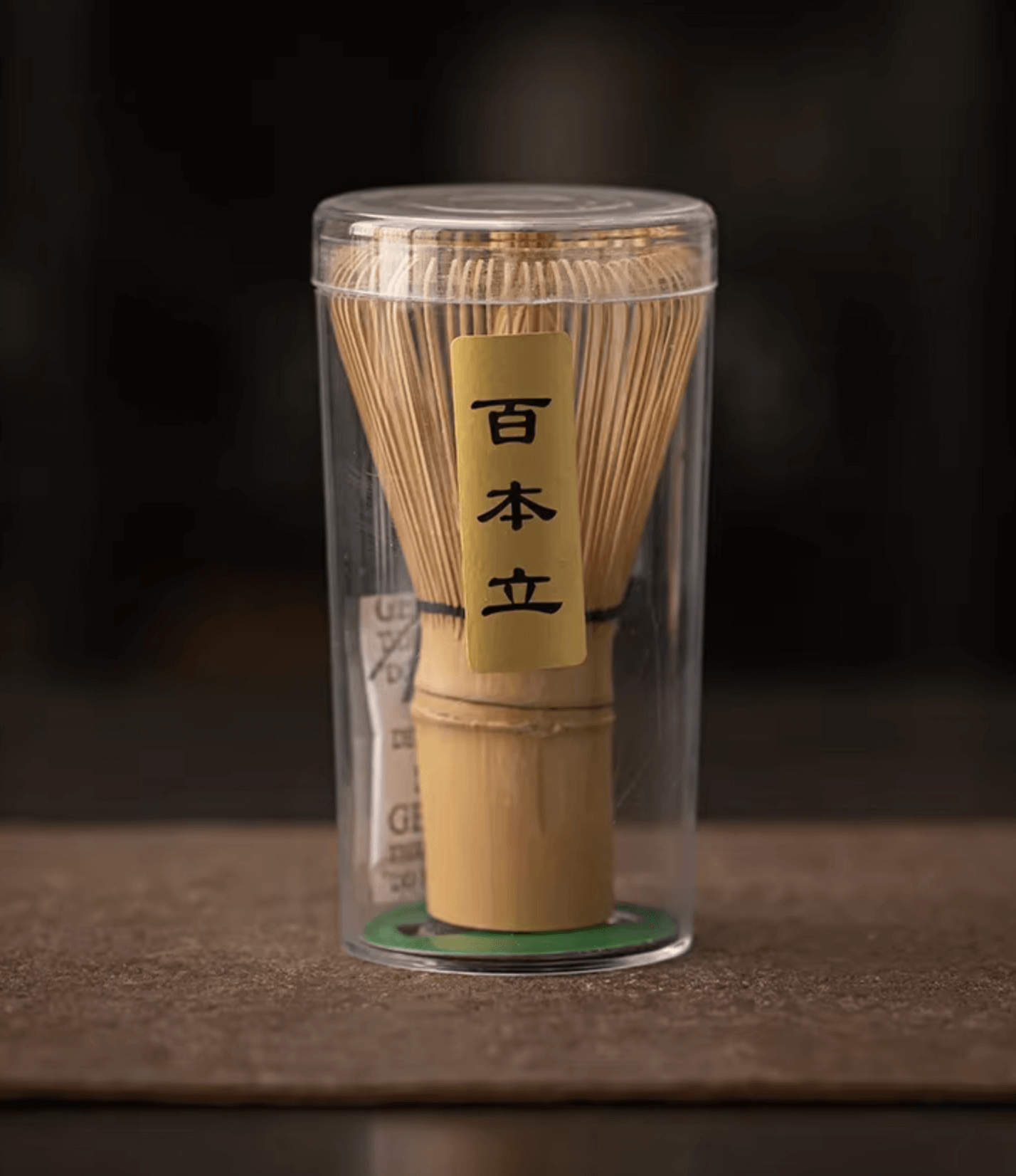 Traditional Japanese bamboo matcha whisk in clear packaging for tea ceremony