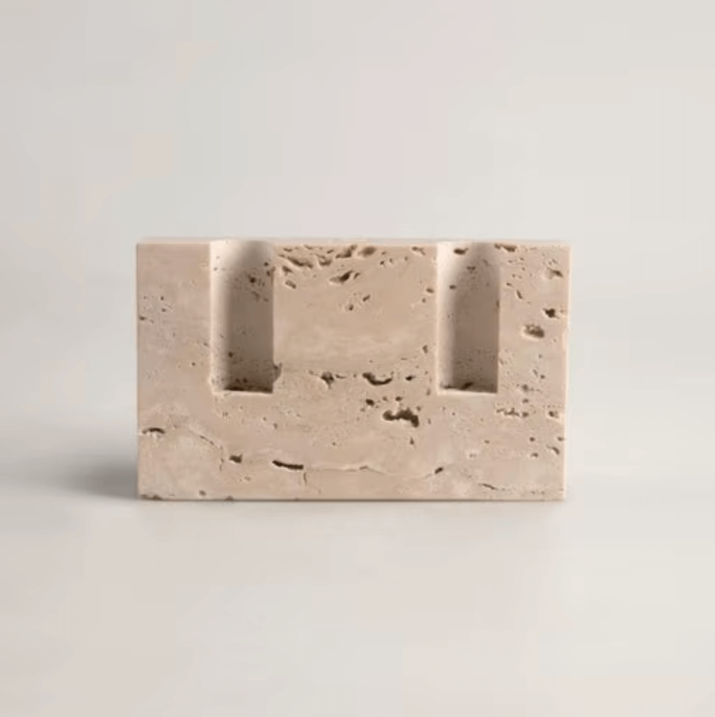 Travertine marble candle holder showcasing Nordic minimalism and elegance, perfect for atmospheric evenings and stylish decor.