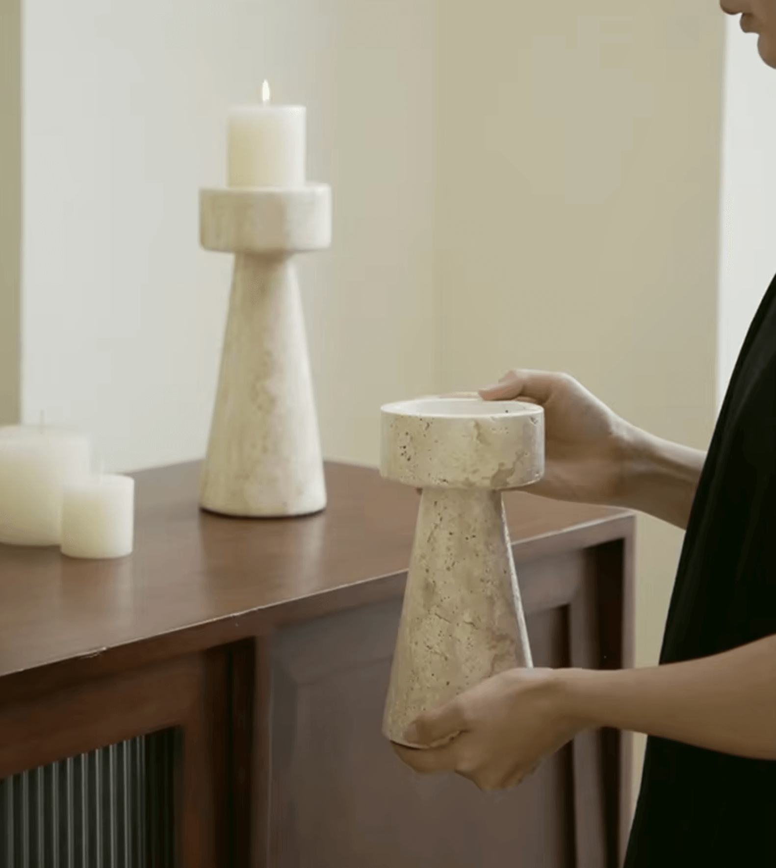 Handcrafted travertine marble candle holder on a wooden table, showcasing timeless elegance in home decor.