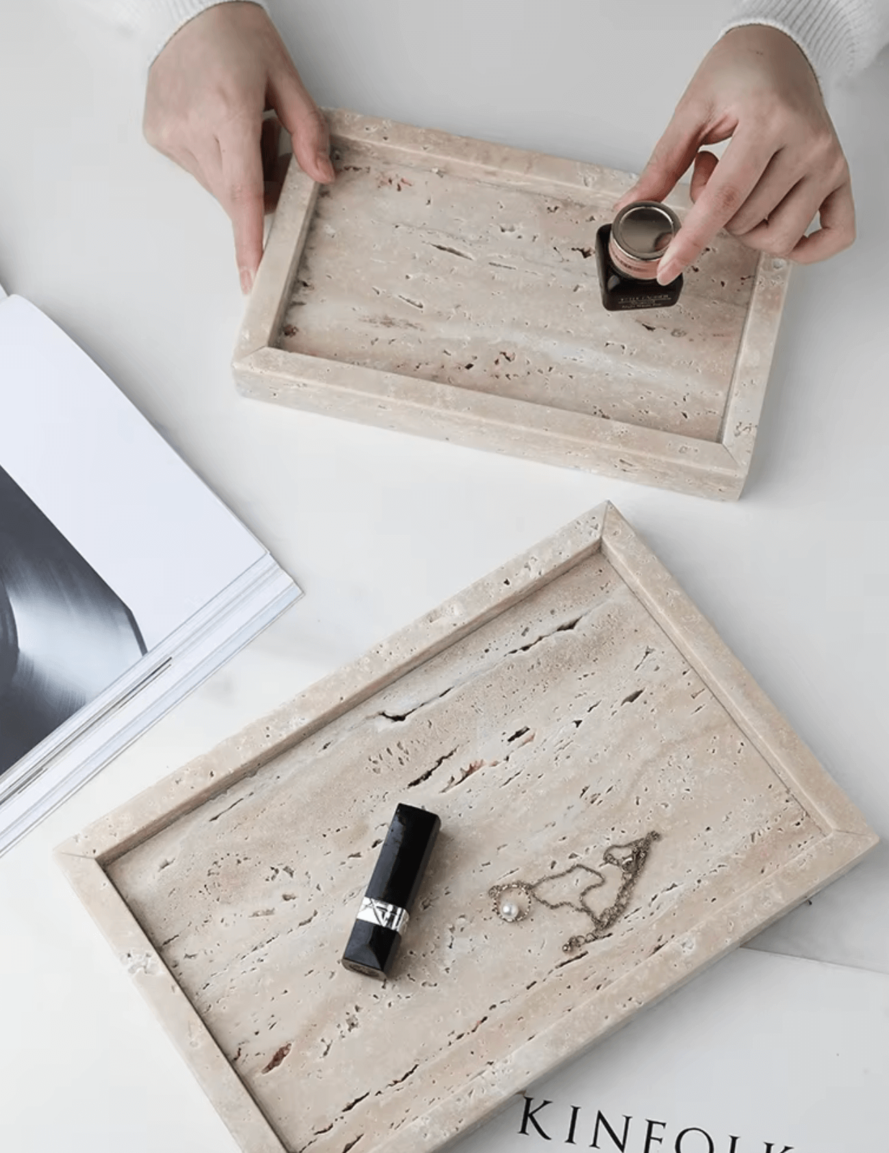 Handcrafted travertine marble trays styled with cosmetics and jewelry, showcasing minimalist elegance and versatile use.