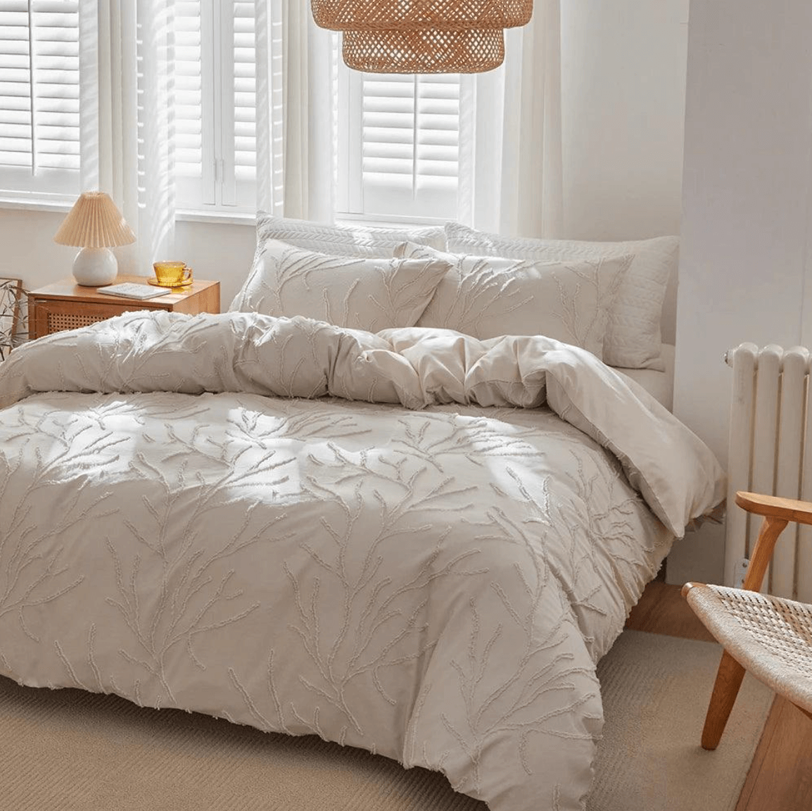Tufted bedding set with beige tree branch design in Boho-Chic style, adds natural elegance and comfort to a bedroom decor.