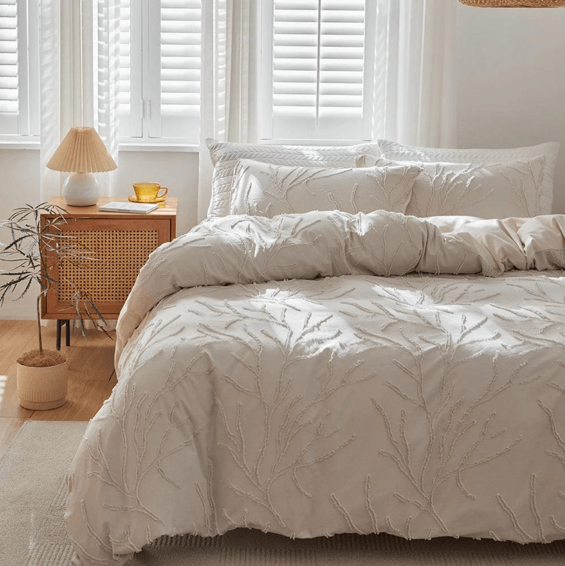 Tufted bed set with boho chic tree branch design in a cozy bedroom setting, featuring beige tones and natural decor.