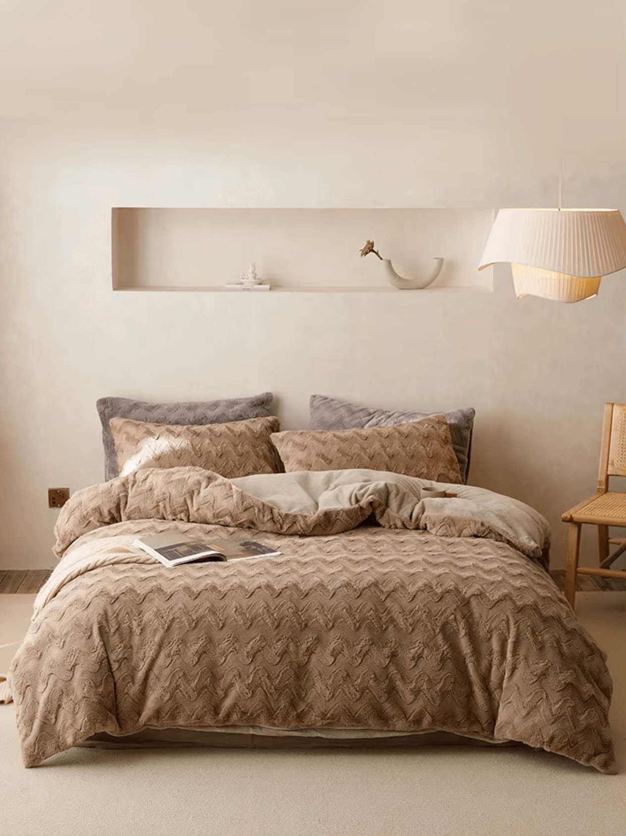 Luxurious Rabbit Cashmere bed set with zig-zag design in warm neutrals, creating a 5-star hotel feel in a cozy bedroom setting.