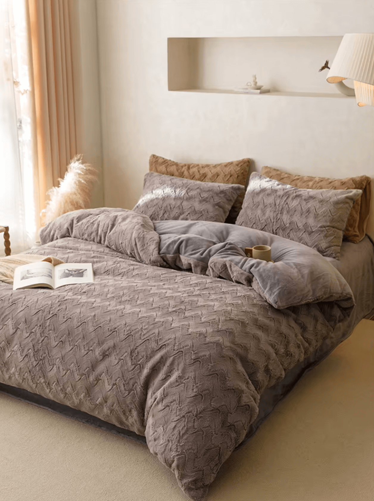Luxurious cashmere bedding set with zig-zag design in brown tones on a stylish, plush bed.