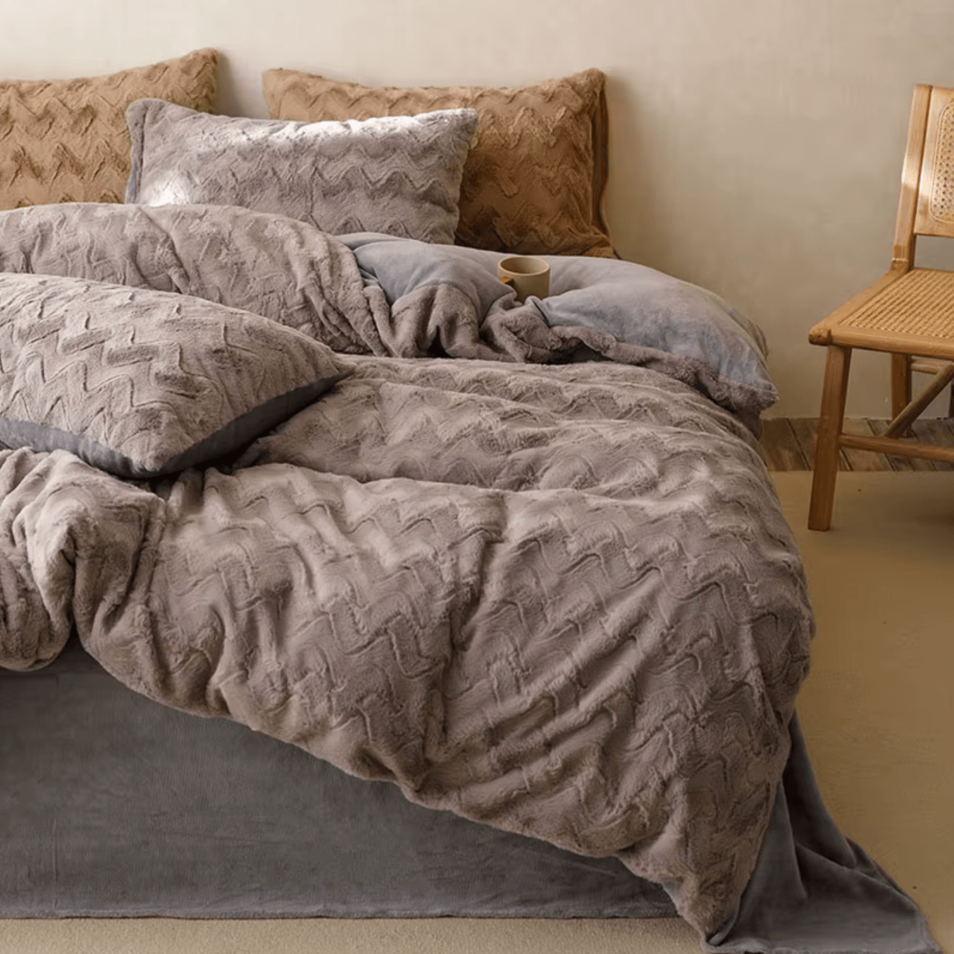 Luxurious rabbit cashmere bedding set with zig-zag design on a bed, featuring plush pillows and a cozy atmosphere.