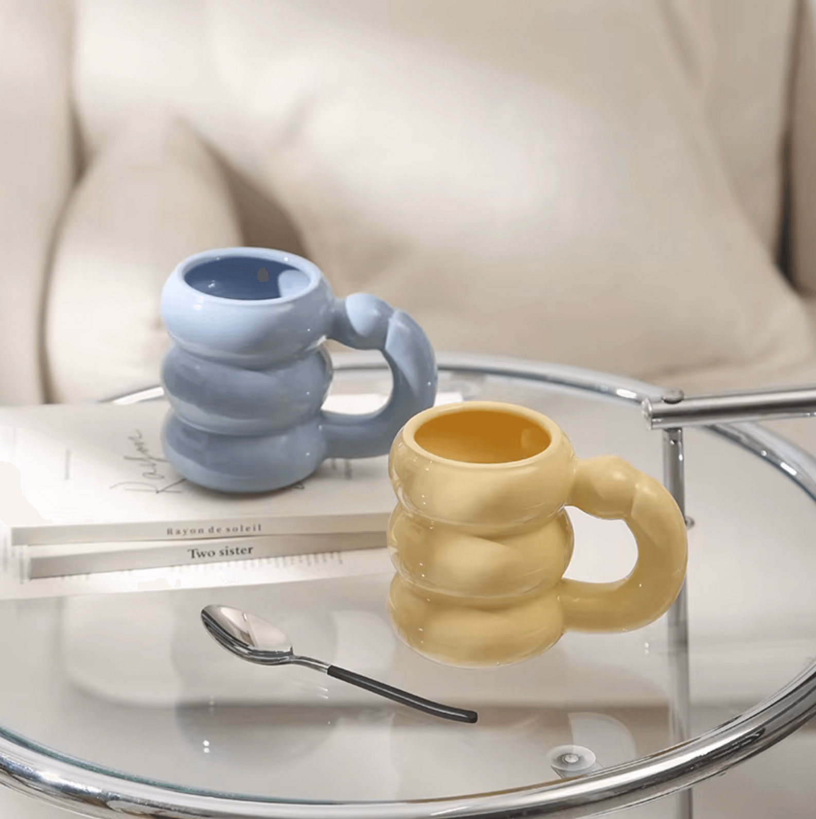 Korean-style Spring Bloom Tasse in blue and yellow on glass table, modern design ideal for trendy coffee lovers.