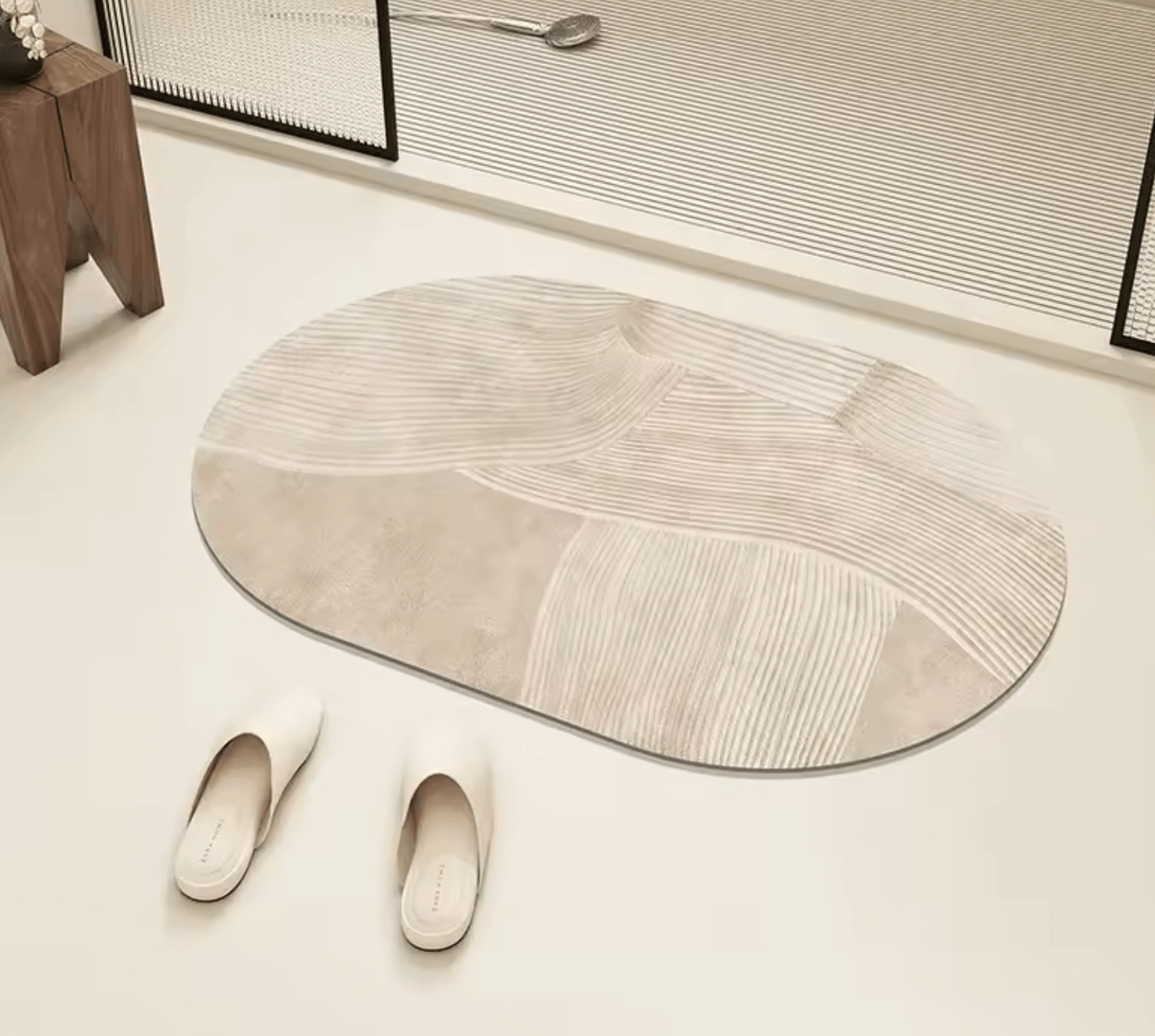 Modern stripe design bath mat made of diatomaceous earth displayed on a bathroom floor with slippers nearby, enhancing decor and functionality.