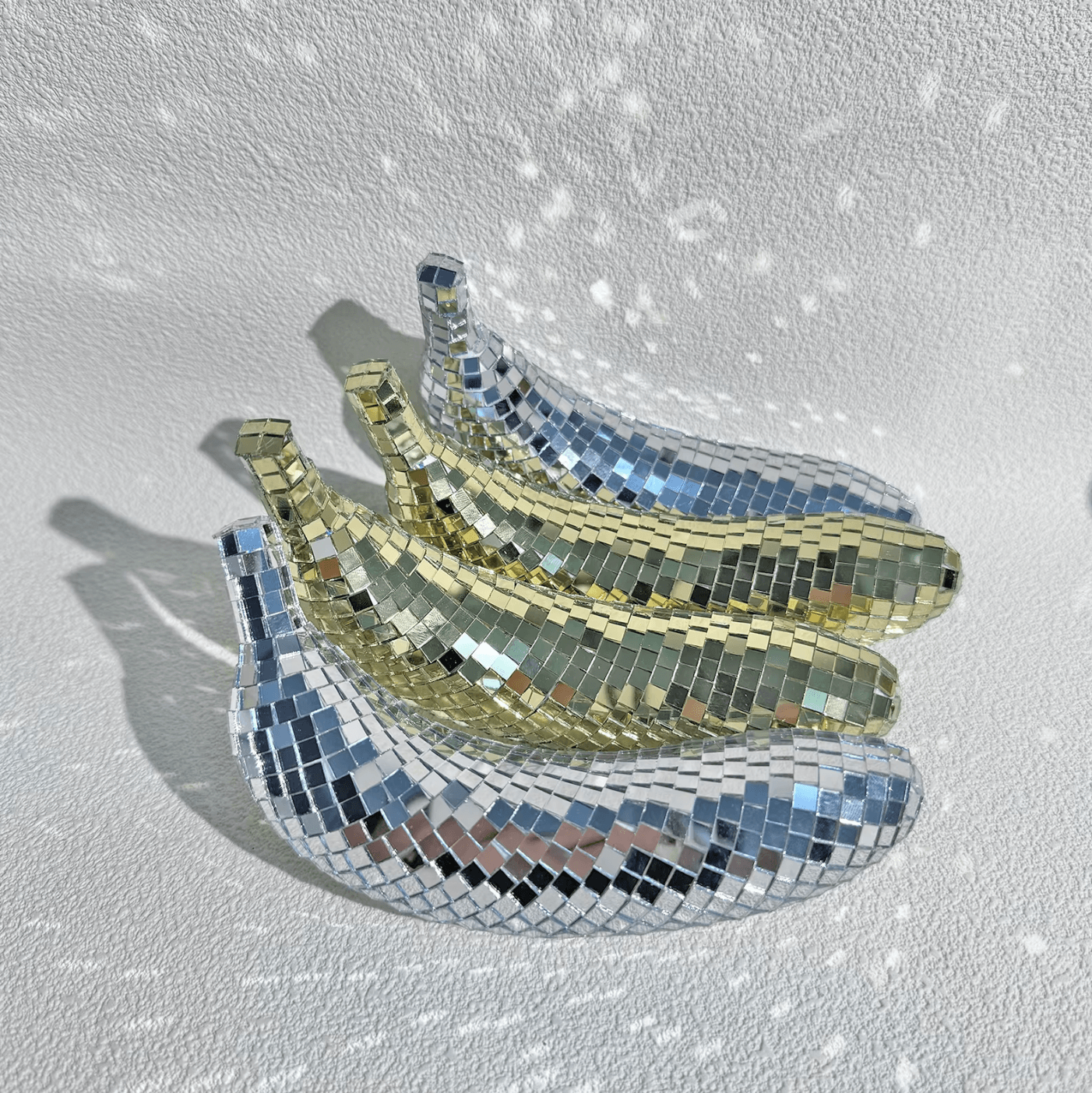 Reflective disco banana decorations set, adding glamour and style to home interiors, perfect for tables or events.