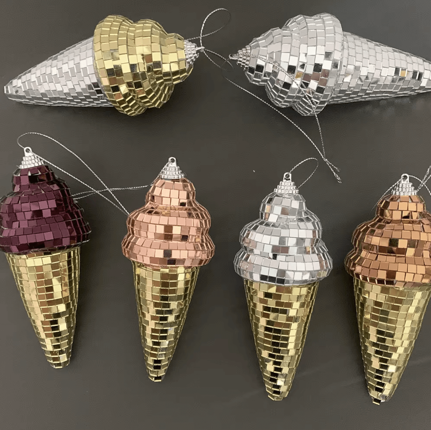 Colorful disco-ice cone mirror ornaments; shimmering gold, silver, copper, and burgundy; unique home decor with retro charm.