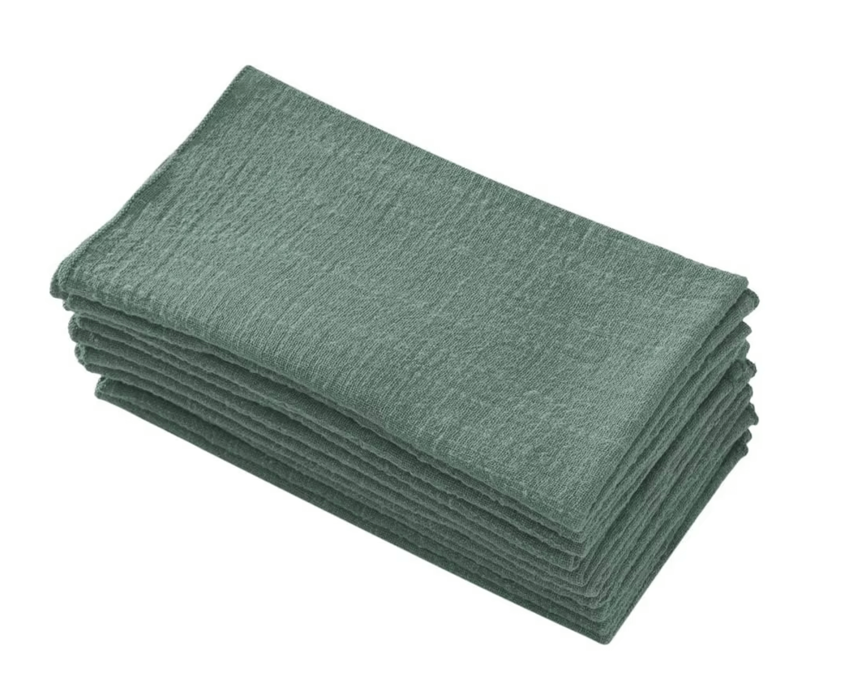 Stack of elegant green cotton napkins offering sustainable dining elegance.