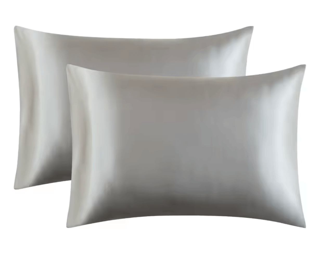Luxurious satin pillowcases in shimmering gray, perfect for enhancing sleep comfort and style.