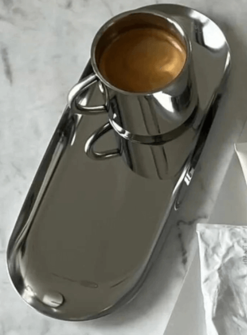 Gold and silver stainless steel tray with a cup, showcasing minimalist luxury for table and decor.
