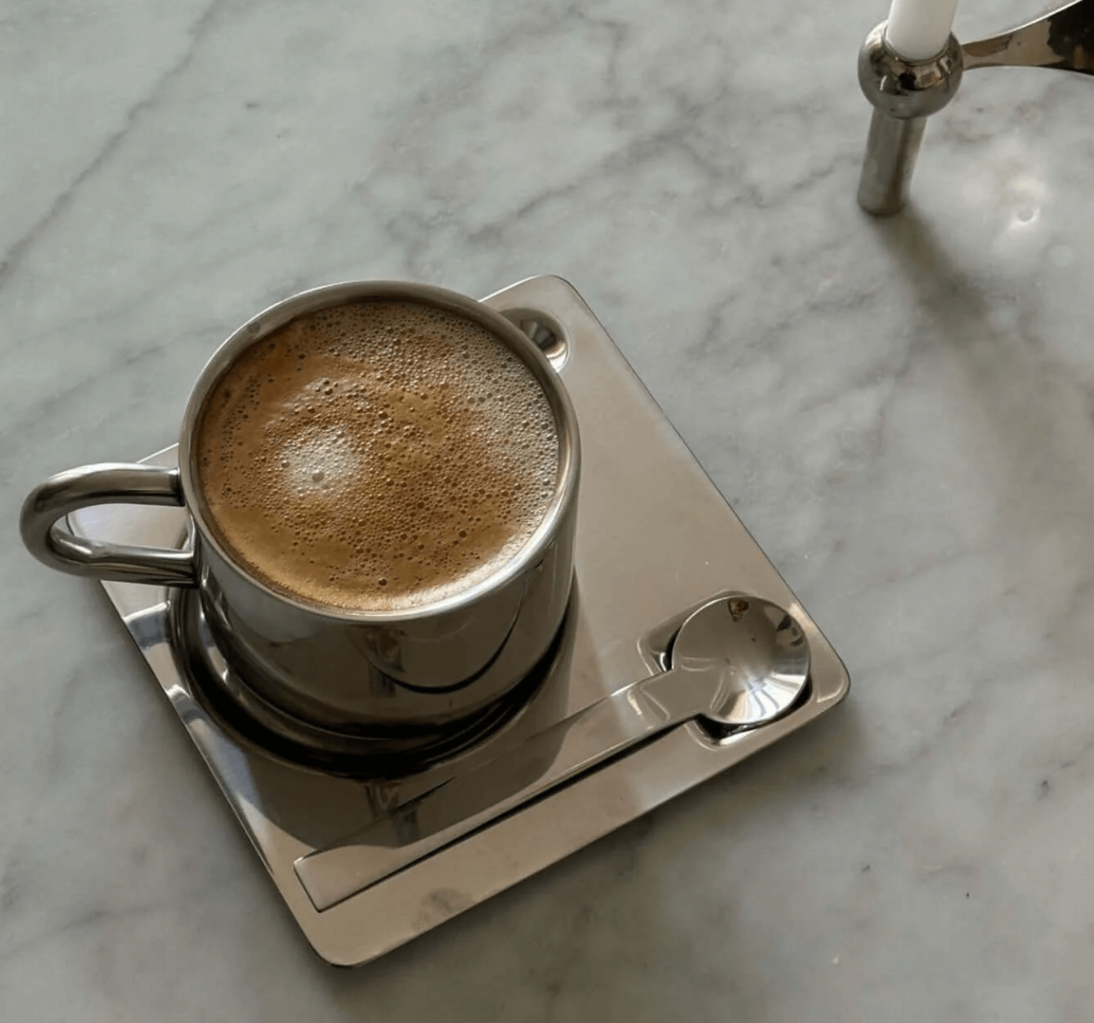 Luxurious double-walled stainless steel coffee set on marble table, perfect for hot beverages with elegant design.