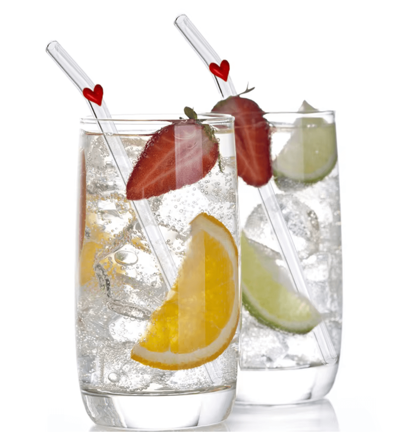 Two glasses with "Pure Sip" glass straws, garnished with fruit slices and heart accents, showcasing style and sustainability.