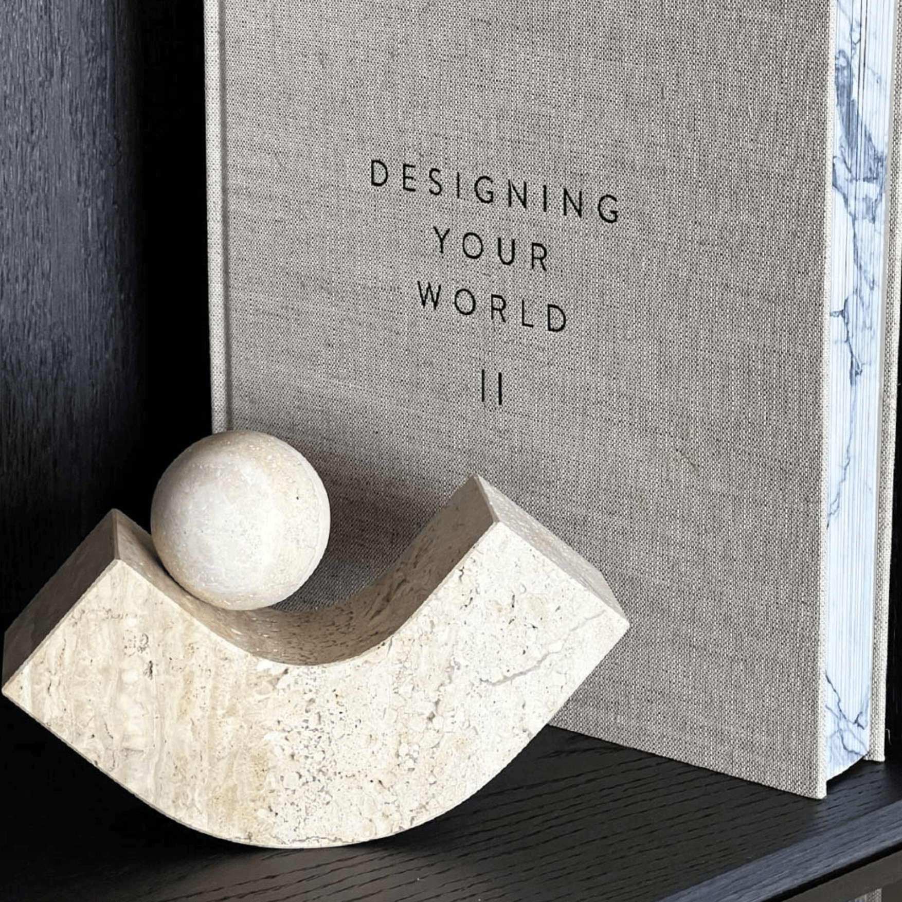 Geometric natural stone bookend with modern aesthetic, complementing books on a shelf. Handcrafted elegance for home or office.