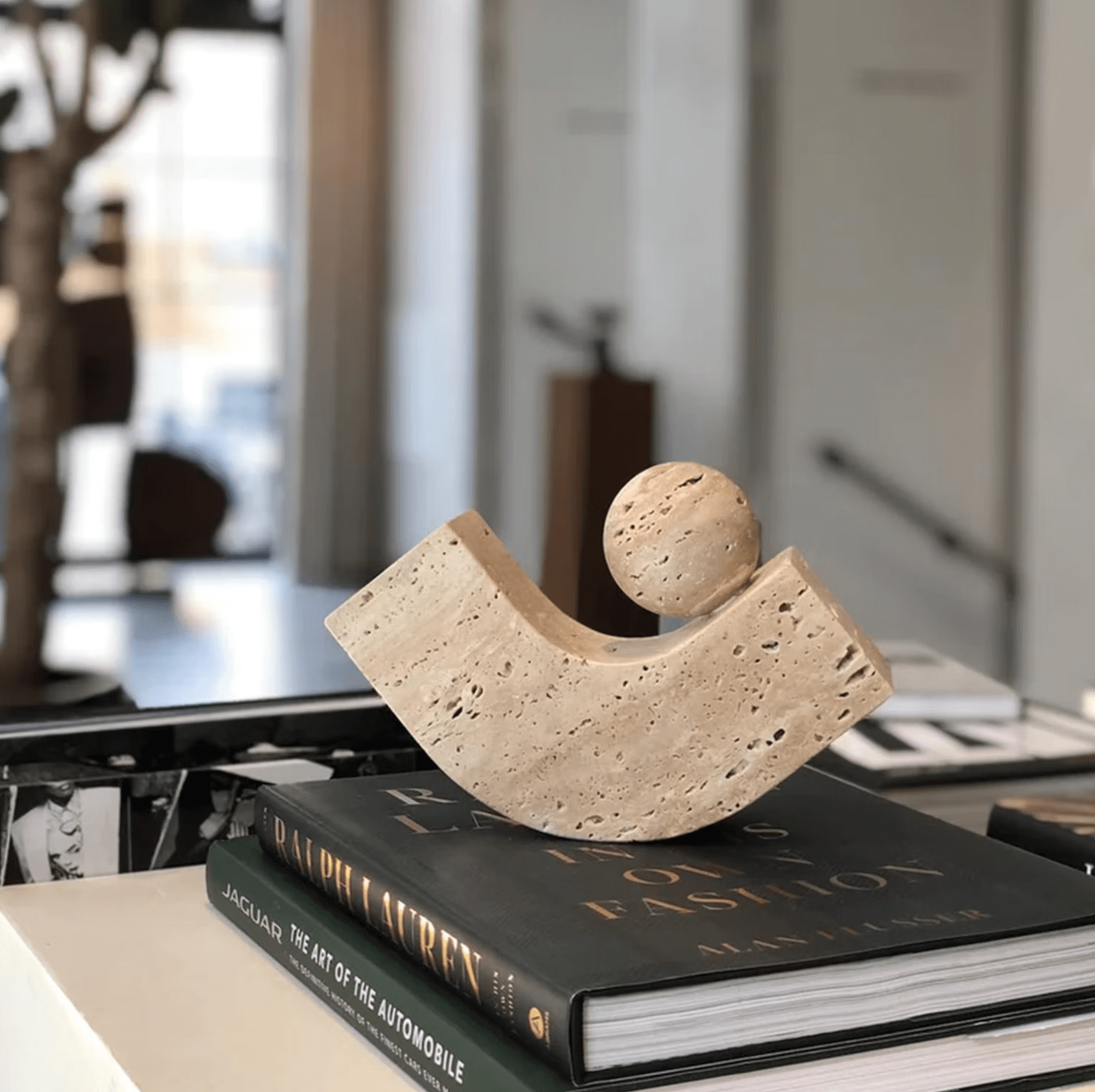 Geometric natural stone bookend on a desk, combining minimalist design with modern aesthetics. Ideal for home or office decor.