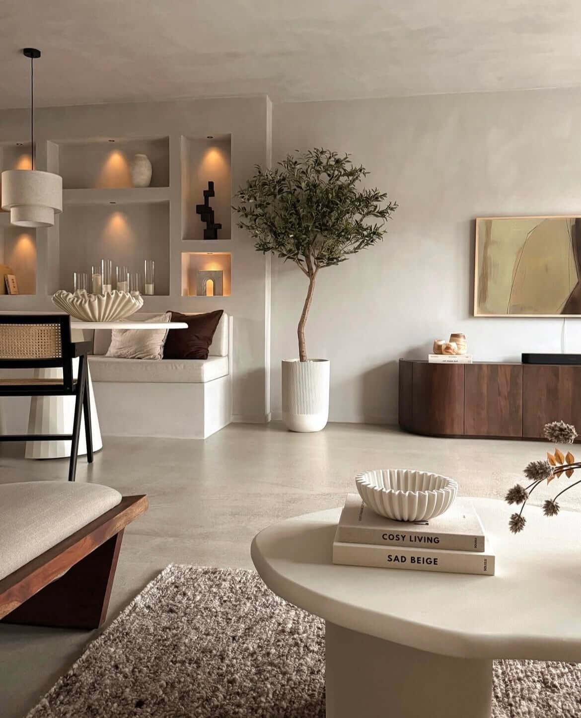 Elegant artificial olive tree in modern living room, enhancing decor with a touch of Mediterranean style. Easy maintenance luxury plant.