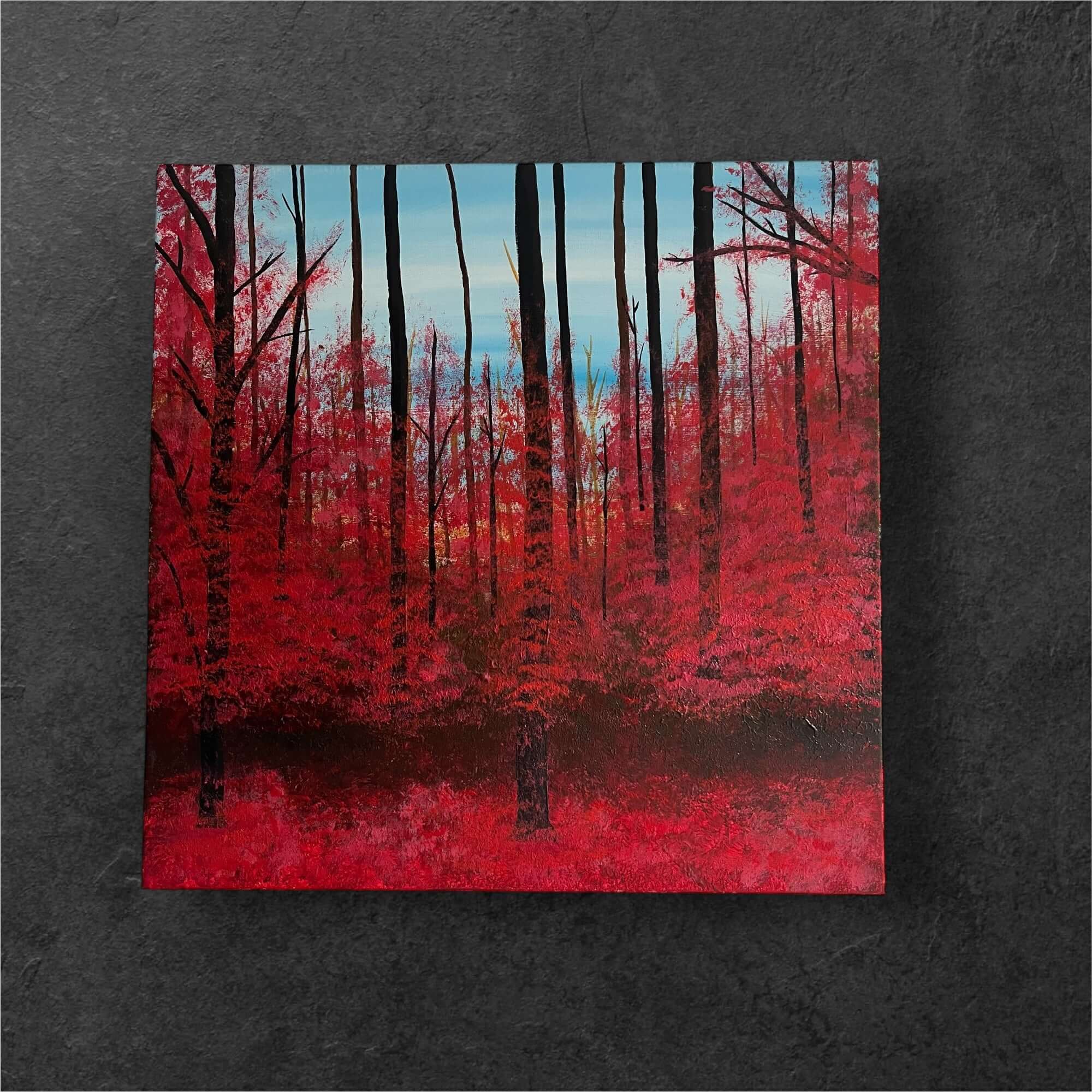 Hand-painted acrylic artwork 'Roter Wald' depicting a vibrant red forest in autumn, size 50x50 cm.