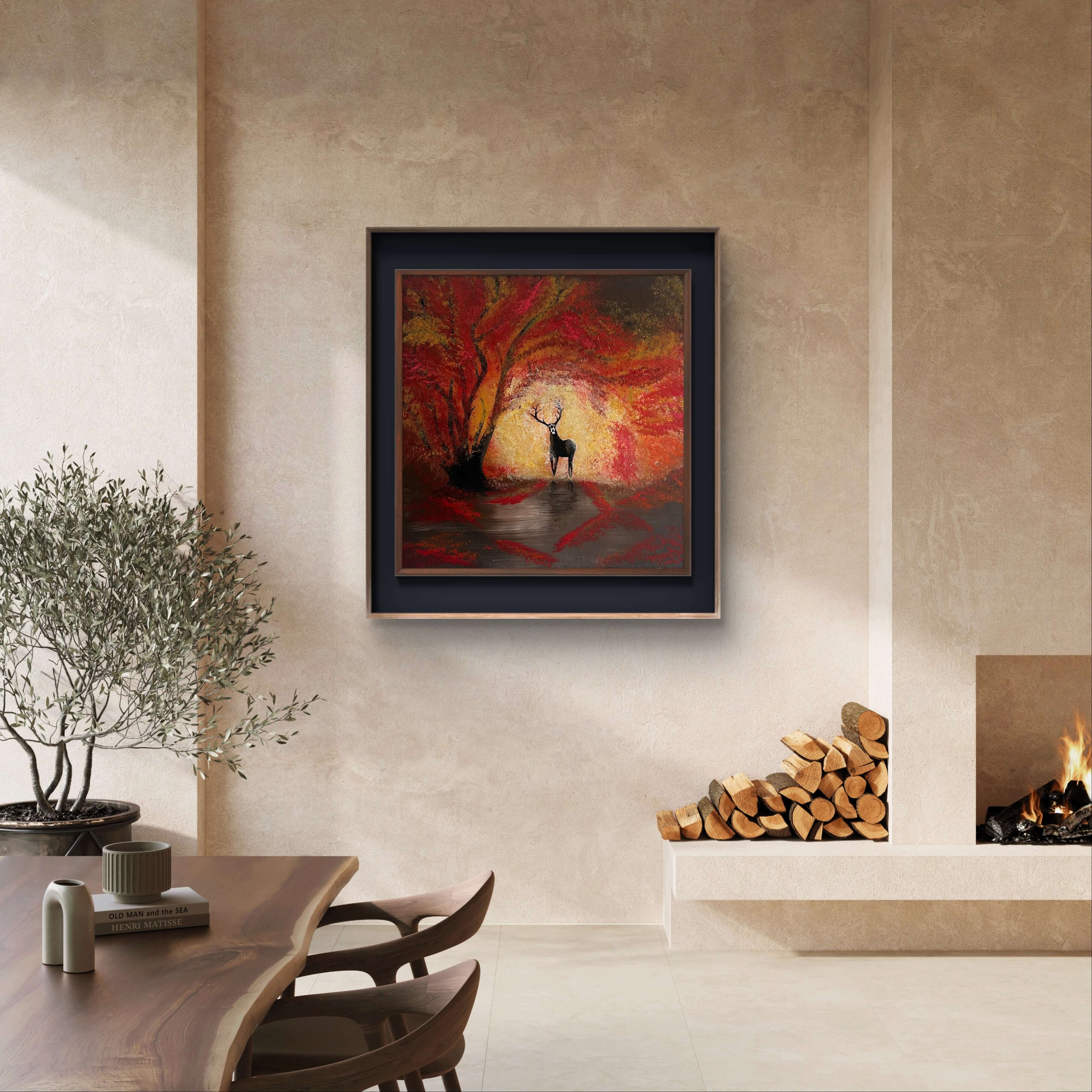 Hand-painted autumn scene with a stag, red leaves, and snowflakes in a 40x40 cm acrylic painting, framed and displayed in a living room.