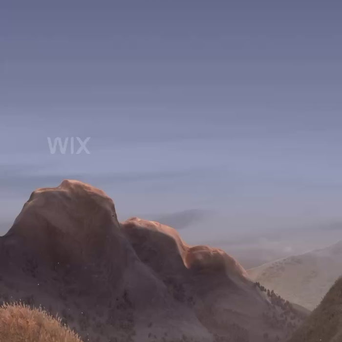 Scenic landscape with mountains at sunset under a clear sky