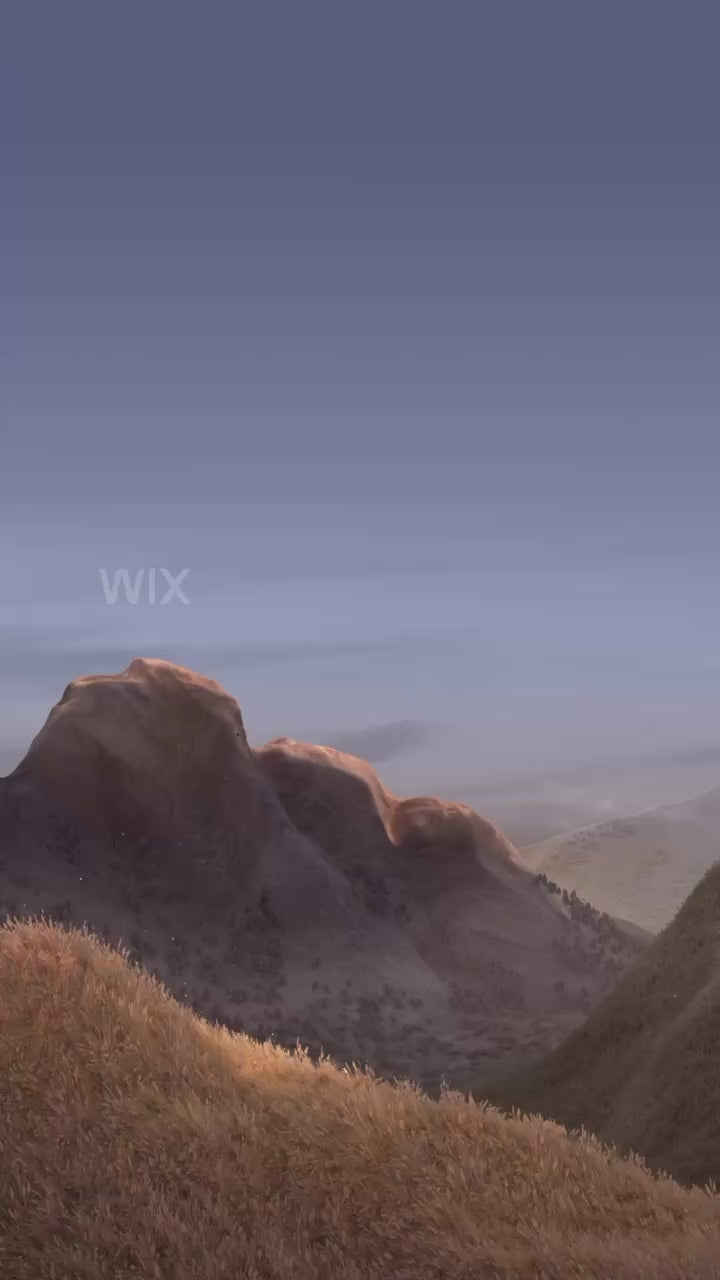 Scenic landscape with mountains at sunset under a clear sky